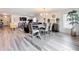 Open floor plan connecting the dining and living areas, filled with natural light and modern furnishings at 16588 Centipede St, Clermont, FL 34714