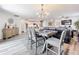 Open-concept layout blending the dining and living spaces, creating an inviting and airy atmosphere at 16588 Centipede St, Clermont, FL 34714