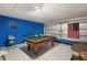 Recreational basement featuring a pool table, and Americana decor, creating a fun space at 16621 Caribbean Breeze Way, Clermont, FL 34714