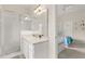 Bathroom with a shower and a sink at 16621 Caribbean Breeze Way, Clermont, FL 34714