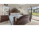 Main bedroom featuring carpet floors, and large windows that overlook the pool at 16621 Caribbean Breeze Way, Clermont, FL 34714