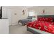 A spacious bedroom with two twin beds, carpet floors, and a large window for ample natural light at 16621 Caribbean Breeze Way, Clermont, FL 34714