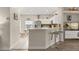 The breakfast bar offers seating in this view of the bright, open floor plan at 16621 Caribbean Breeze Way, Clermont, FL 34714