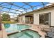Beautiful screened-in pool and spa with plenty of room for relaxation at 16621 Caribbean Breeze Way, Clermont, FL 34714