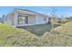 Backyard of home with covered patio and well maintained lawn at 1737 Carnelian St, Deland, FL 32720