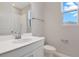 Bright bathroom with white vanity, modern fixtures, and a window for natural light at 1737 Carnelian St, Deland, FL 32720