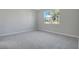 Neutral bedroom with carpet floors and single hung window at 1737 Carnelian St, Deland, FL 32720