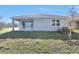 Exterior of modern home featuring covered patio and sliding glass doors at 1737 Carnelian St, Deland, FL 32720