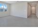 Spacious living area with light tile flooring, neutral walls, and abundant natural light at 1737 Carnelian St, Deland, FL 32720