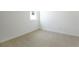 Comfortable carpeted bedroom with a window and neutral tones, ready for personalization at 1747 Carnelian St, Deland, FL 32720