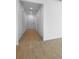Bright hallway featuring wood-look tile flooring, recessed lighting, and access to multiple rooms at 1747 Carnelian St, Deland, FL 32720