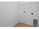 Functional laundry room with tile flooring, overhead shelving, and hookups for washer and dryer at 1747 Carnelian St, Deland, FL 32720