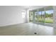 Bright living room with tile floors and sliding glass doors, offering easy access to outdoor spaces at 1747 Carnelian St, Deland, FL 32720