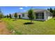 Backyard featuring a manicured lawn, perfect for outdoor relaxation and activities at 1749 Carnelian St, Deland, FL 32720