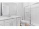 Bathroom with white vanity and glass-enclosed shower at 1749 Carnelian St, Deland, FL 32720
