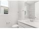 Bathroom featuring a white vanity with a quartz countertop, toilet, and a shower with glass doors at 1749 Carnelian St, Deland, FL 32720