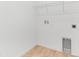 Tile laundry room, featuring a utility sink, shelf, and washer and dryer hookups at 1749 Carnelian St, Deland, FL 32720