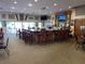 Interior shot of the community clubhouse, featuring a fully stocked bar with multiple seats at 1750 Saint Tropez Ct, Kissimmee, FL 34744