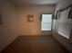 Bedroom featuring carpet, a window with blinds, and neutral decor at 1750 Saint Tropez Ct, Kissimmee, FL 34744