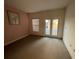 Bedroom with window and glass door to balcony at 1750 Saint Tropez Ct, Kissimmee, FL 34744