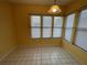 Sunny breakfast nook with bright yellow walls and a view of the exterior at 1750 Saint Tropez Ct, Kissimmee, FL 34744
