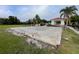 Exterior view of an empty concrete slab next to the canal, offering potential for creative use and expansion at 1750 Saint Tropez Ct, Kissimmee, FL 34744
