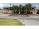 Exterior view of the club house with beautiful landscaping, enhancing the community's welcoming ambiance at 1750 Saint Tropez Ct, Kissimmee, FL 34744