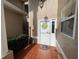 Inviting front entrance with decorative wreath, mosaic tiled floor, and manicured shrubbery at 1750 Saint Tropez Ct, Kissimmee, FL 34744