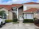 Charming home featuring a well-manicured lawn and a welcoming front entrance with a decorative wreath at 1750 Saint Tropez Ct, Kissimmee, FL 34744