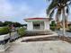 Waterfront gazebo featuring red tile roof, white lattice, with seating area and lovely water views at 1750 Saint Tropez Ct, Kissimmee, FL 34744