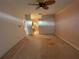 Spacious main bedroom with ceiling fan leading to Primary bathroom with bathtub at 1750 Saint Tropez Ct, Kissimmee, FL 34744