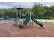 The community playground area features a slide and climbing structure for fun and active play at 1750 Saint Tropez Ct, Kissimmee, FL 34744