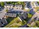 Aerial view of condo complex with multiple parking spaces, well maintained landscaping, and walking paths at 2031 Ludlow Ln # 3303, Orlando, FL 32839
