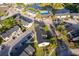 An aerial view of a condo community with a swimming pool and pond surrounded by lush trees and green spaces at 2031 Ludlow Ln # 3303, Orlando, FL 32839