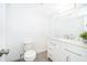 Clean bathroom featuring a modern vanity with quartz countertops and a new toilet at 2031 Ludlow Ln # 3303, Orlando, FL 32839