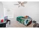 Carpeted bedroom featuring a ceiling fan, window, and ample natural light at 2031 Ludlow Ln # 3303, Orlando, FL 32839