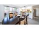 Charming dining area adjacent to the kitchen boasts a dark wood table and a sliding glass door at 2031 Ludlow Ln # 3303, Orlando, FL 32839