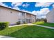 Exterior view of a multi-Gathering home with a well maintained lawn and sidewalks at 2031 Ludlow Ln # 3303, Orlando, FL 32839