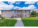 Two-story condo featuring well-maintained landscaping and inviting curb appeal at 2031 Ludlow Ln # 3303, Orlando, FL 32839