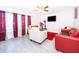 Inviting living room features a ceiling fan and bright, neutral color palette at 2031 Ludlow Ln # 3303, Orlando, FL 32839