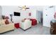 Bright living room boasts a ceiling fan, recessed lights, and modern gray flooring at 2031 Ludlow Ln # 3303, Orlando, FL 32839