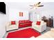 Cozy living area with ceiling fan, recessed lights, gray flooring, and bright color accents at 2031 Ludlow Ln # 3303, Orlando, FL 32839