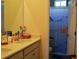 Bright bathroom featuring a double sink vanity and a shower with a playful sea-themed curtain at 2057 Celebration Blvd, Celebration, FL 34747