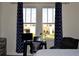 Bright bedroom with a workspace featuring a desk, office chair, and a window view at 2057 Celebration Blvd, Celebration, FL 34747