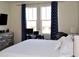 Bright bedroom featuring large windows, desk, and stylish decor at 2057 Celebration Blvd, Celebration, FL 34747