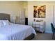 Inviting bedroom featuring a comfortable bed, stylish dresser, and serene decor at 2057 Celebration Blvd, Celebration, FL 34747
