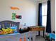 Fun bedroom featuring a Hot Wheels decor, foosball table, and themed bedding at 2057 Celebration Blvd, Celebration, FL 34747