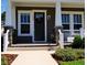 Close up of a charming home entrance, featuring elegant columns and a welcoming front porch at 2057 Celebration Blvd, Celebration, FL 34747