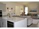 Open-concept kitchen and living room area with a kitchen island at 2057 Celebration Blvd, Celebration, FL 34747