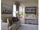 Inviting living room with a comfortable couch, stylish decor, and a view of the white Yamaha piano at 2057 Celebration Blvd, Celebration, FL 34747